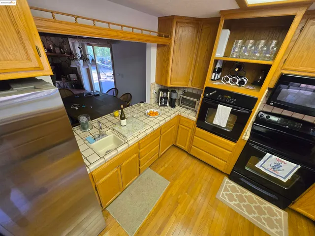 a bed room with a bed and a television