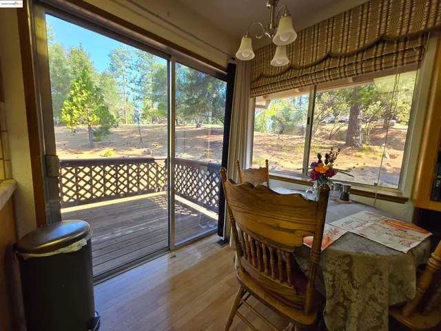 a kitchen with a refrigerator and white countertops