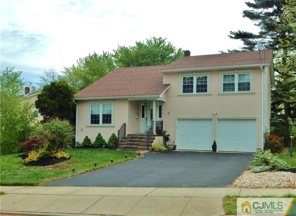 18 Villanova Road Old Bridge, NJ 08859 - Photo 1 of 25 a view of a white house with a yard and plants