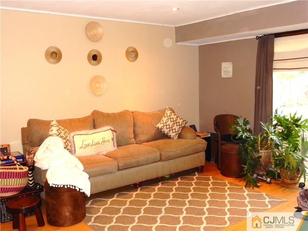 18 Villanova Road Old Bridge, NJ 08859 - Photo 14 of 25 a living room with furniture and flowers