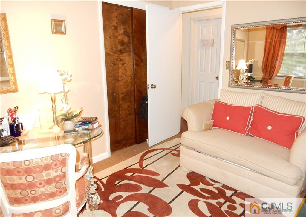 18 Villanova Road Old Bridge, NJ 08859 - Photo 22 of 25 a living room with a couch and a potted plant