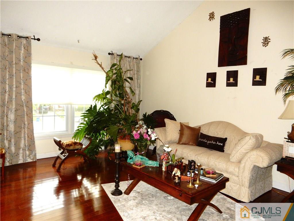 18 Villanova Road Old Bridge, NJ 08859 - Photo 4 of 25 a living room with furniture and a potted plant