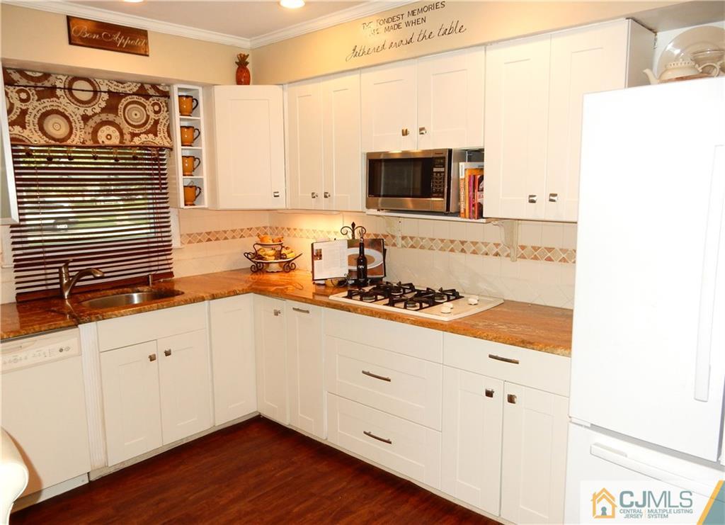 18 Villanova Road Old Bridge, NJ 08859 - Photo 6 of 25 a kitchen with stainless steel appliances a sink and cabinets