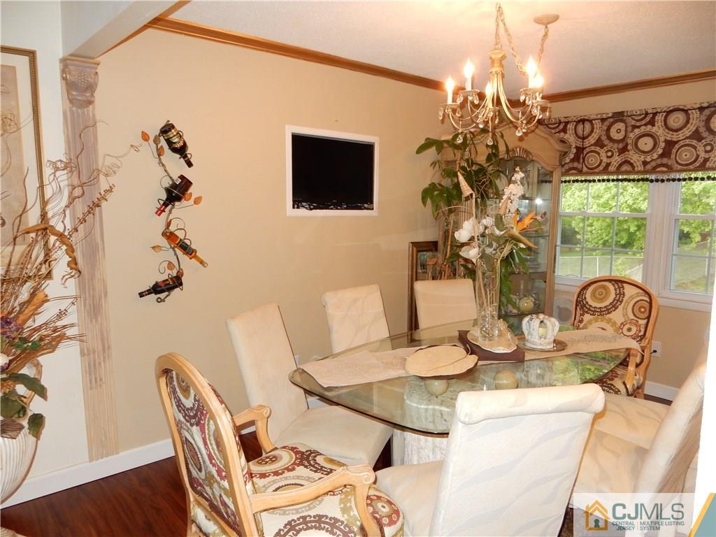 18 Villanova Road Old Bridge, NJ 08859 - Photo 10 of 25 a view of a dining room with furniture a chandelier and wooden floor