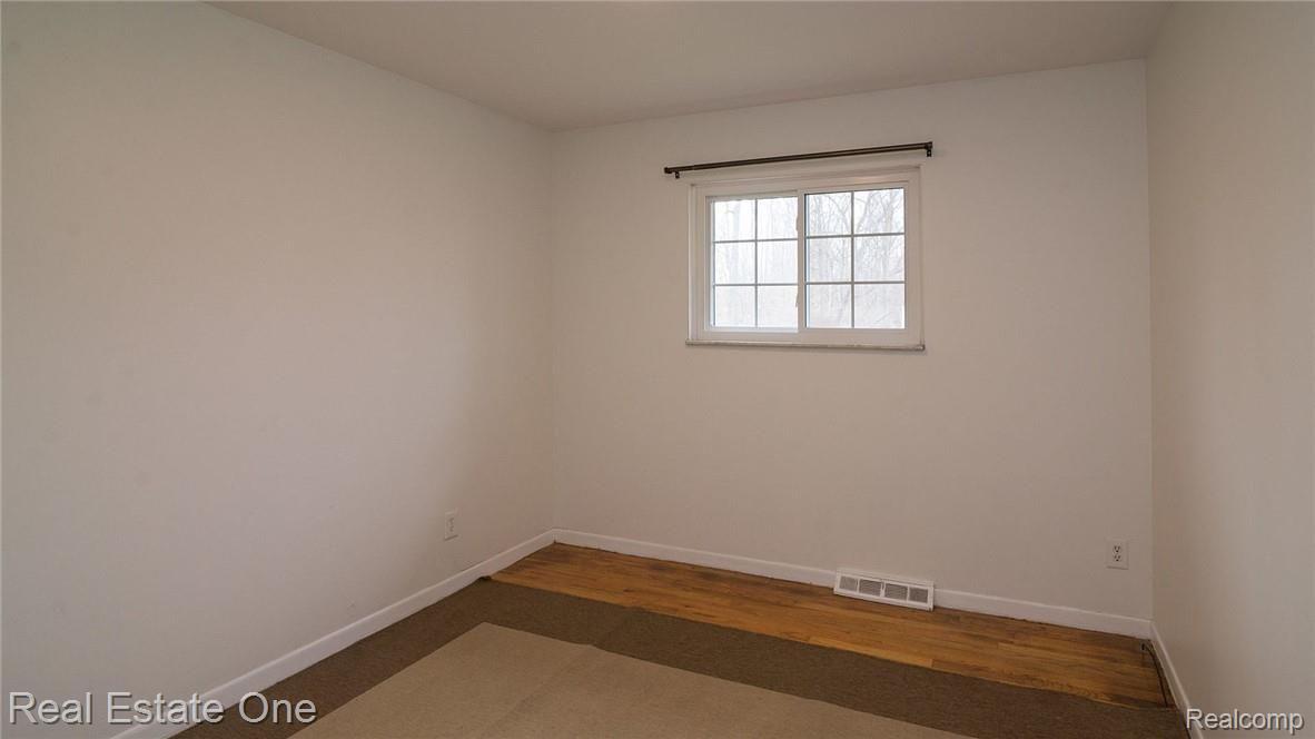 2655 Porter Road White Lake, MI 48383 - Photo 18 of 39 Bedroom 2, with hardwood floors.