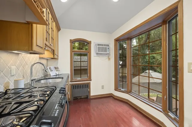 a kitchen with stainless steel appliances granite countertop a stove and a refrigerator