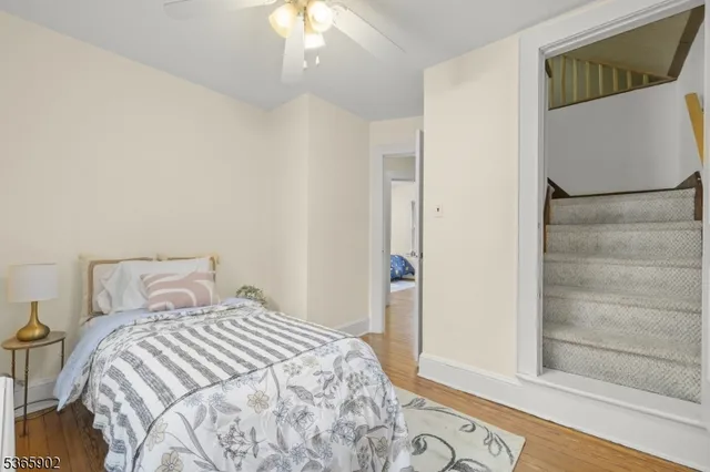 a bedroom with a bed and a mirror