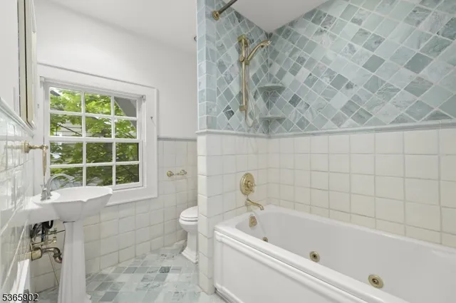 a bathroom with a bathtub and window