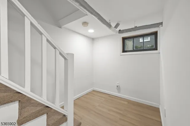a view of an empty room and glass door