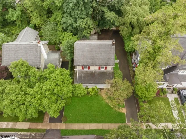 a view of a house with a yard and deck