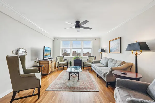 a living room with furniture and a lamp