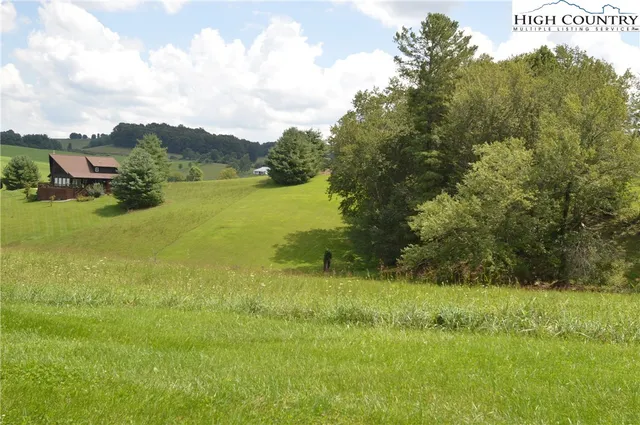 a view of a lake with a big yard