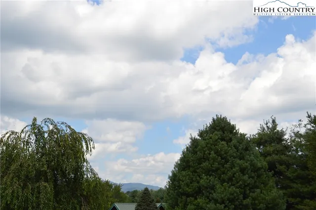 a view of lake with green space