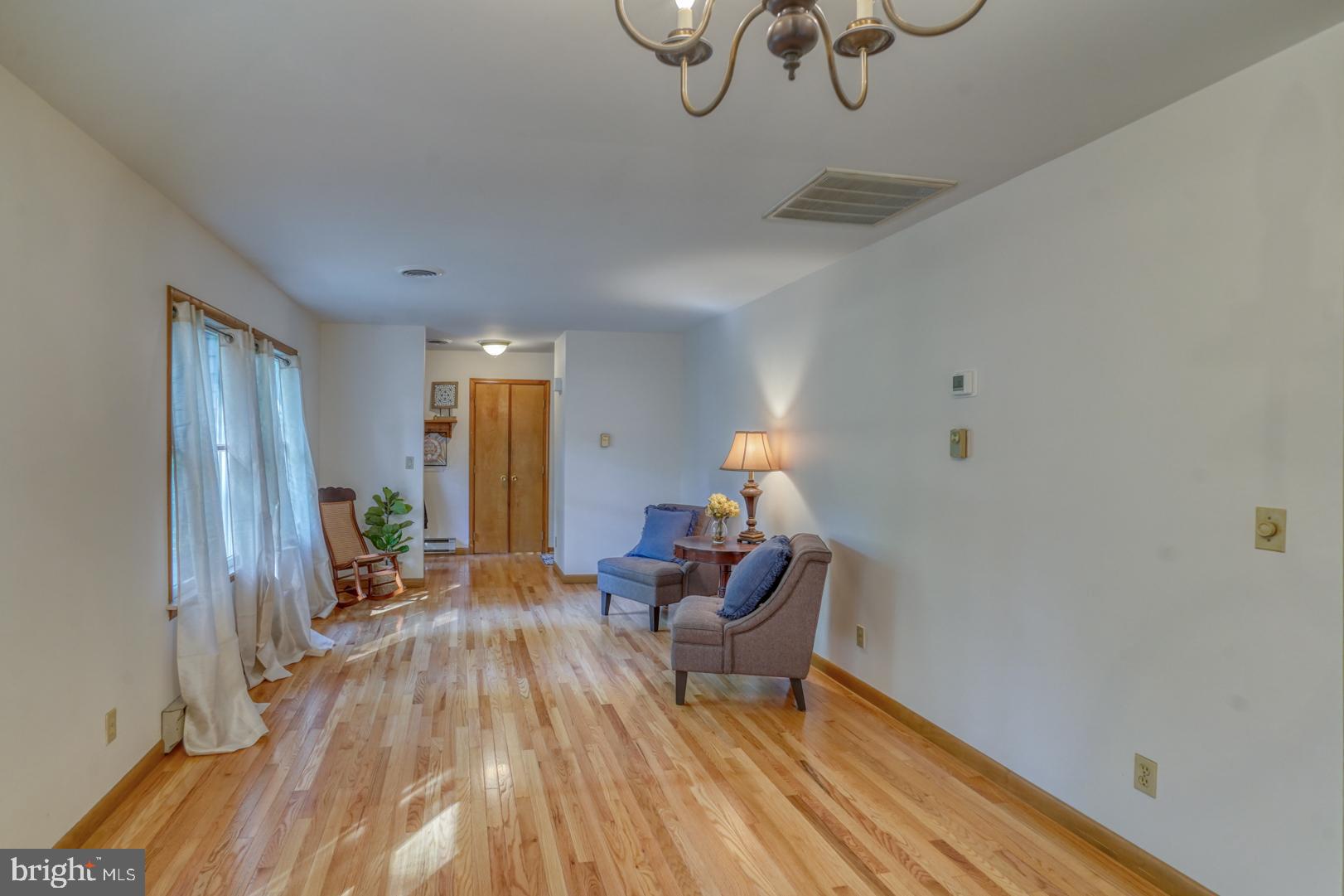 1966 Vandyke Greenspring Road Smyrna, DE 19977 - Photo 14 of 45 a living room with furniture and wooden floor