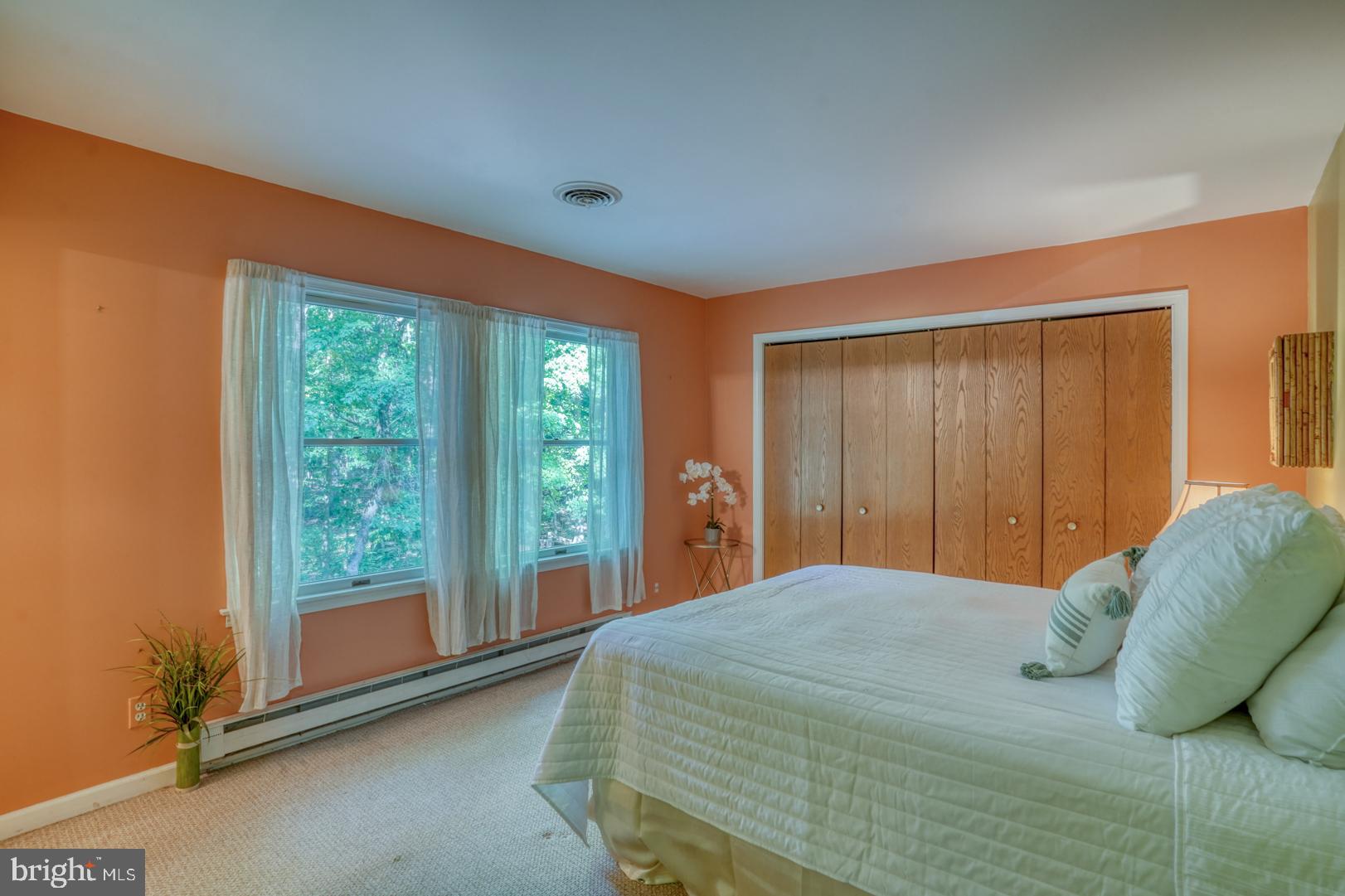 1966 Vandyke Greenspring Road Smyrna, DE 19977 - Photo 18 of 45 a bedroom with a bed and glass door