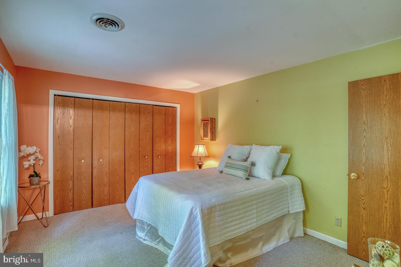 1966 Vandyke Greenspring Road Smyrna, DE 19977 - Photo 19 of 45 a bedroom with a bed and a table