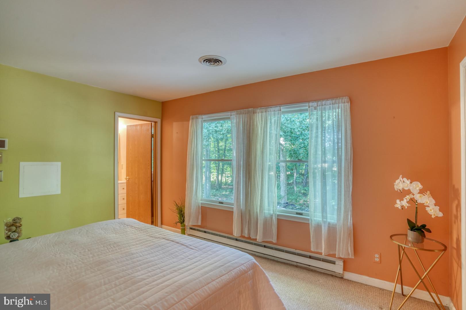 1966 Vandyke Greenspring Road Smyrna, DE 19977 - Photo 20 of 45 a bedroom with a bed and a window