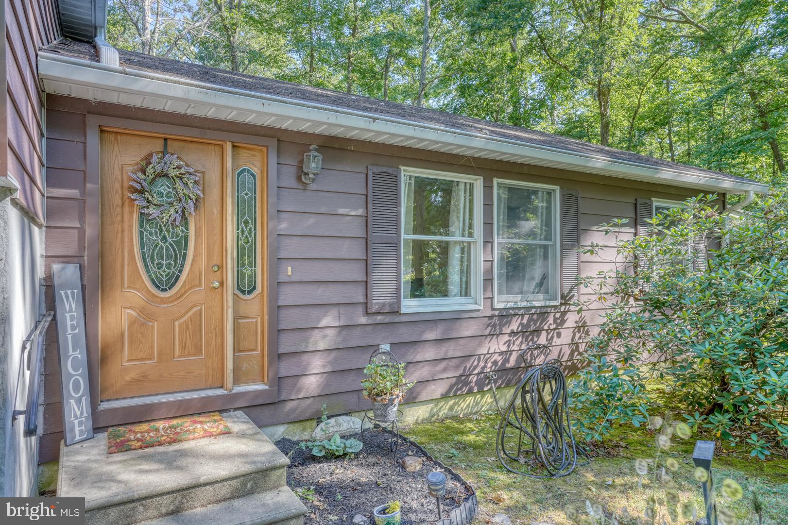 1966 Vandyke Greenspring Road Smyrna, DE 19977 - Photo 2 of 45 a front view of a house with a garden