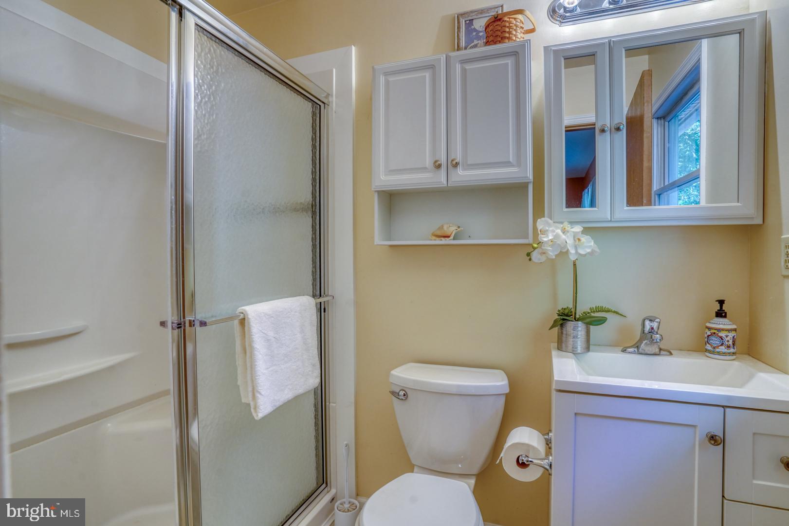 1966 Vandyke Greenspring Road Smyrna, DE 19977 - Photo 21 of 45 a bathroom with a toilet and a sink