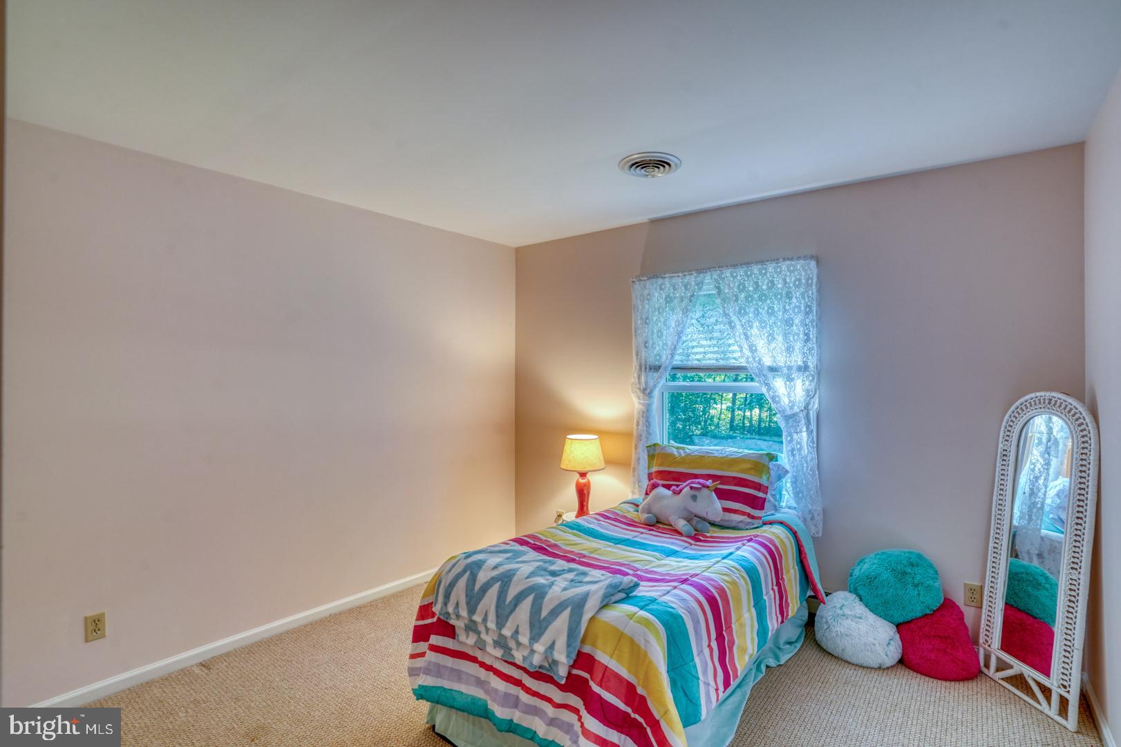 1966 Vandyke Greenspring Road Smyrna, DE 19977 - Photo 24 of 45 a bedroom with a bed and a window