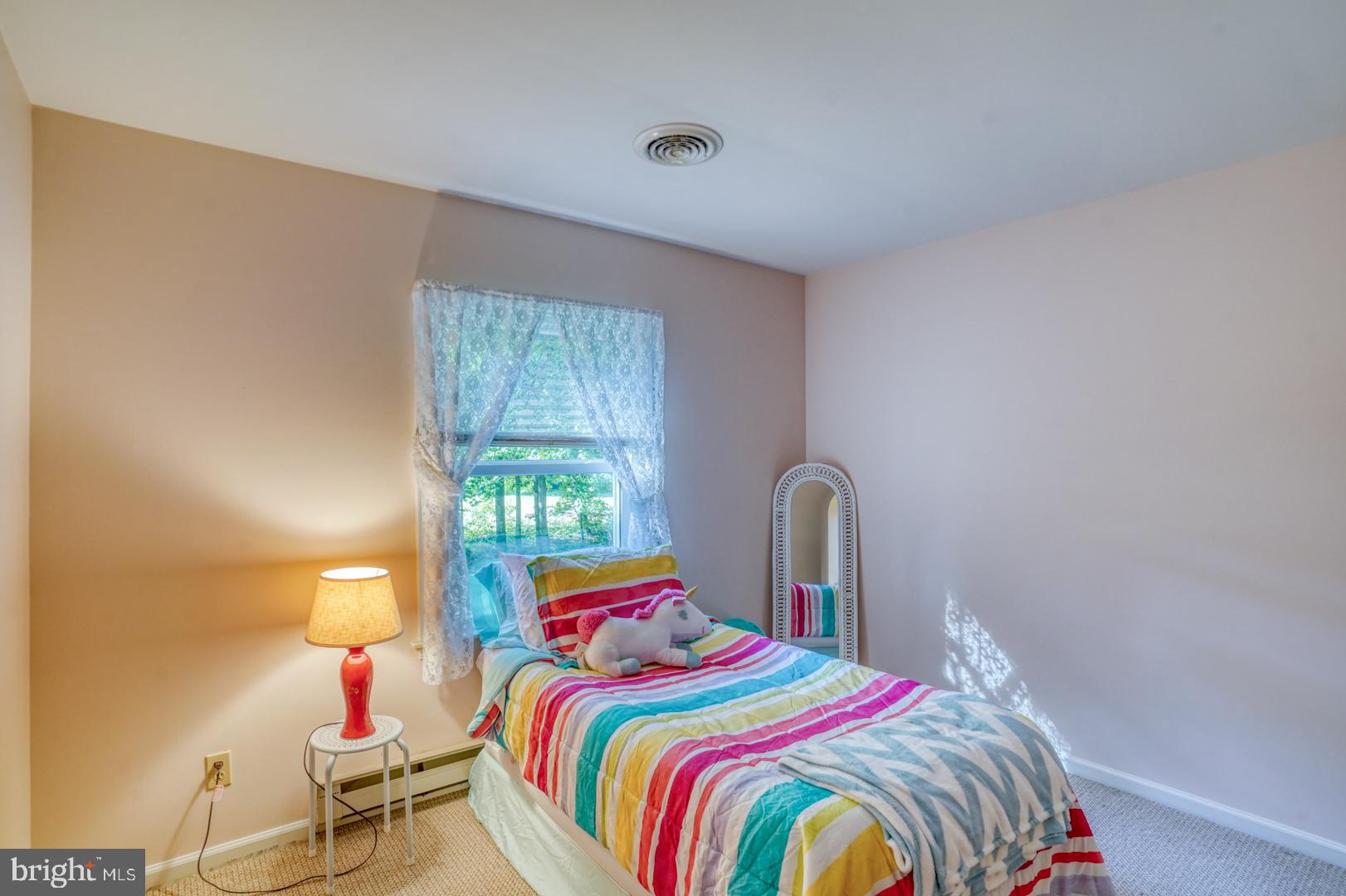 1966 Vandyke Greenspring Road Smyrna, DE 19977 - Photo 25 of 45 a bedroom with a bed and a window