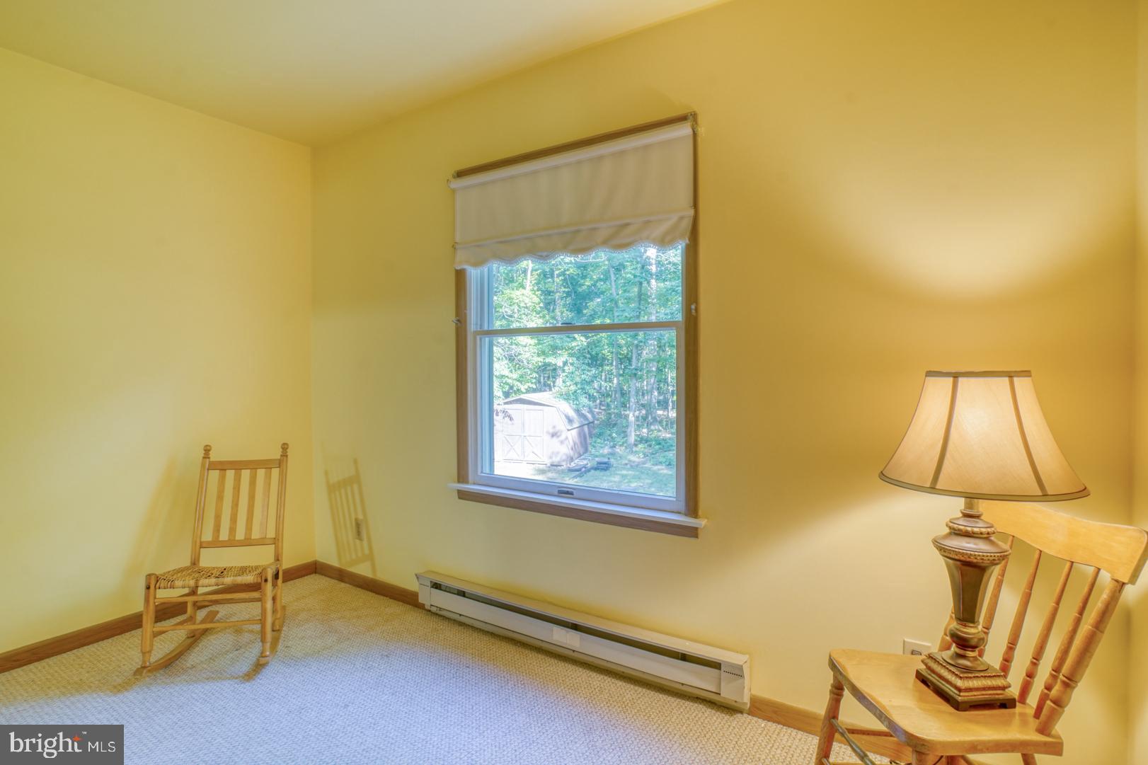 1966 Vandyke Greenspring Road Smyrna, DE 19977 - Photo 28 of 45 a view of a room with a window and a chair