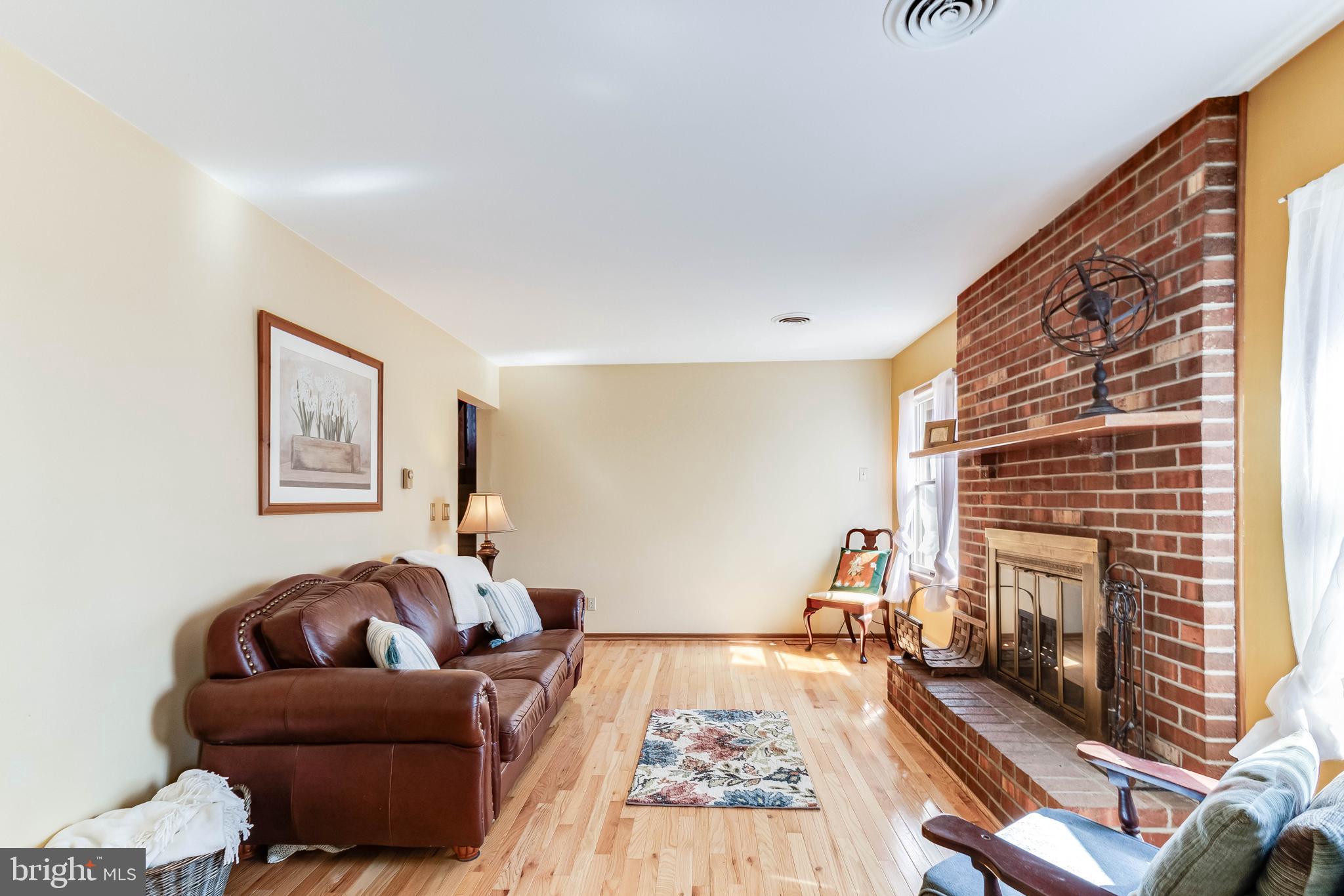 1966 Vandyke Greenspring Road Smyrna, DE 19977 - Photo 7 of 45 a living room with furniture and a fireplace