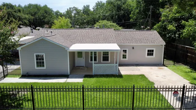 a front view of a house with a yard and porch