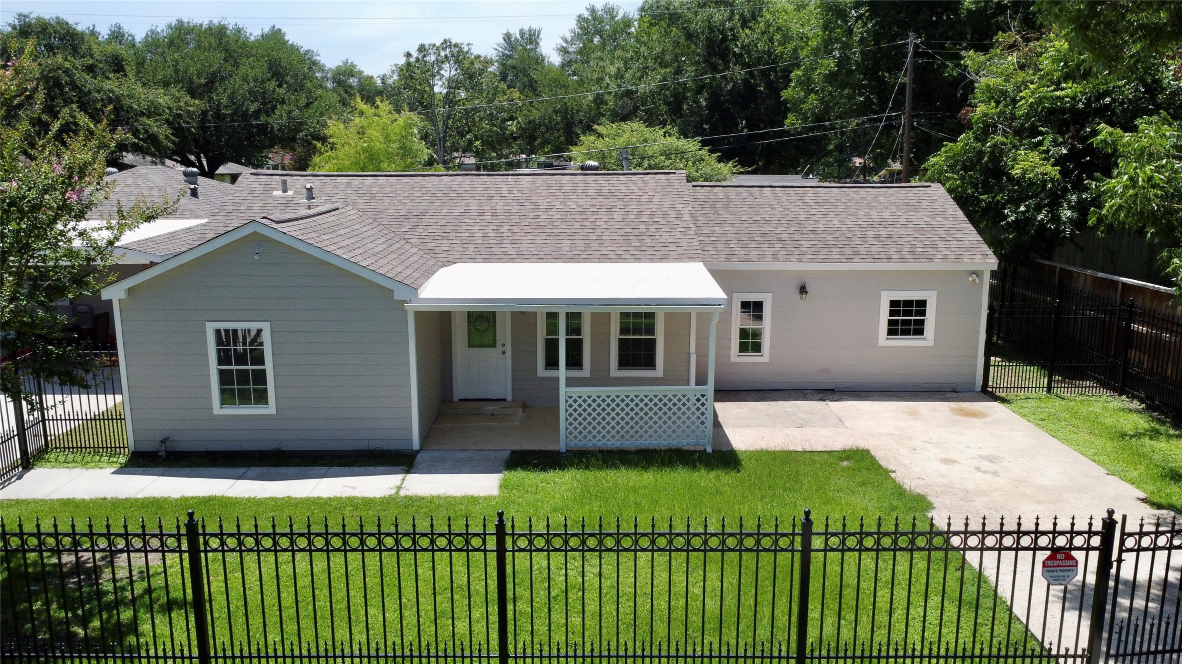 a front view of a house with a yard and porch
