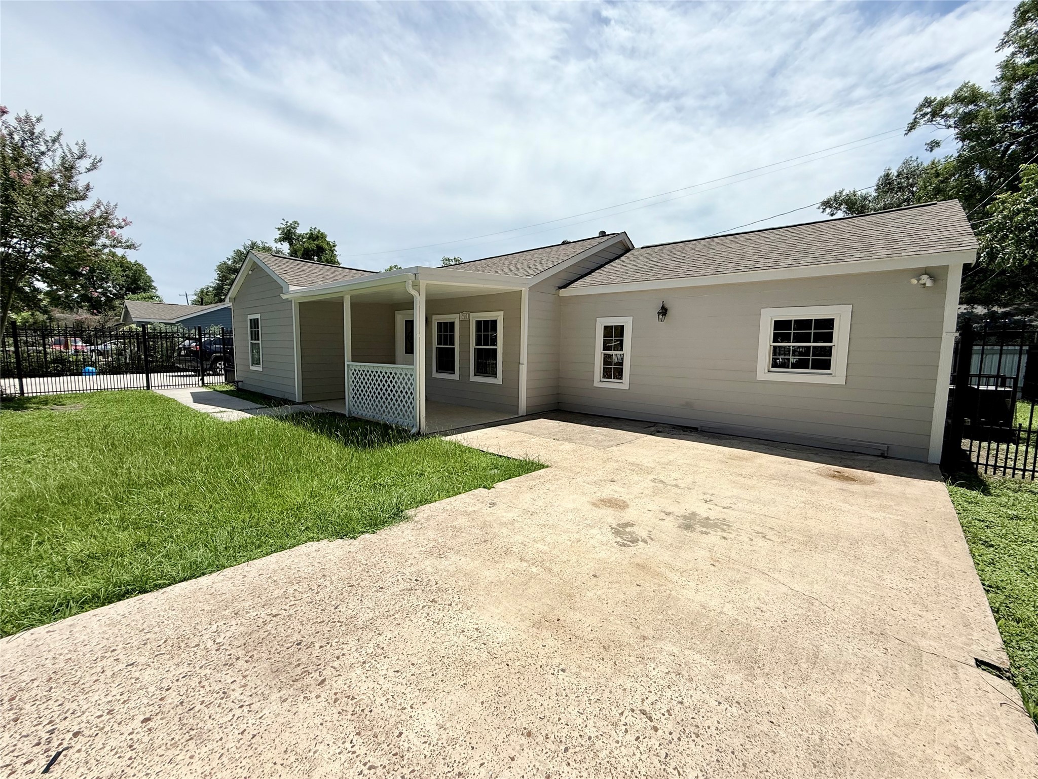 5701 Luna Street Houston, TX 77076 - Photo 15 of 50 a view of a house with a yard and potted plants