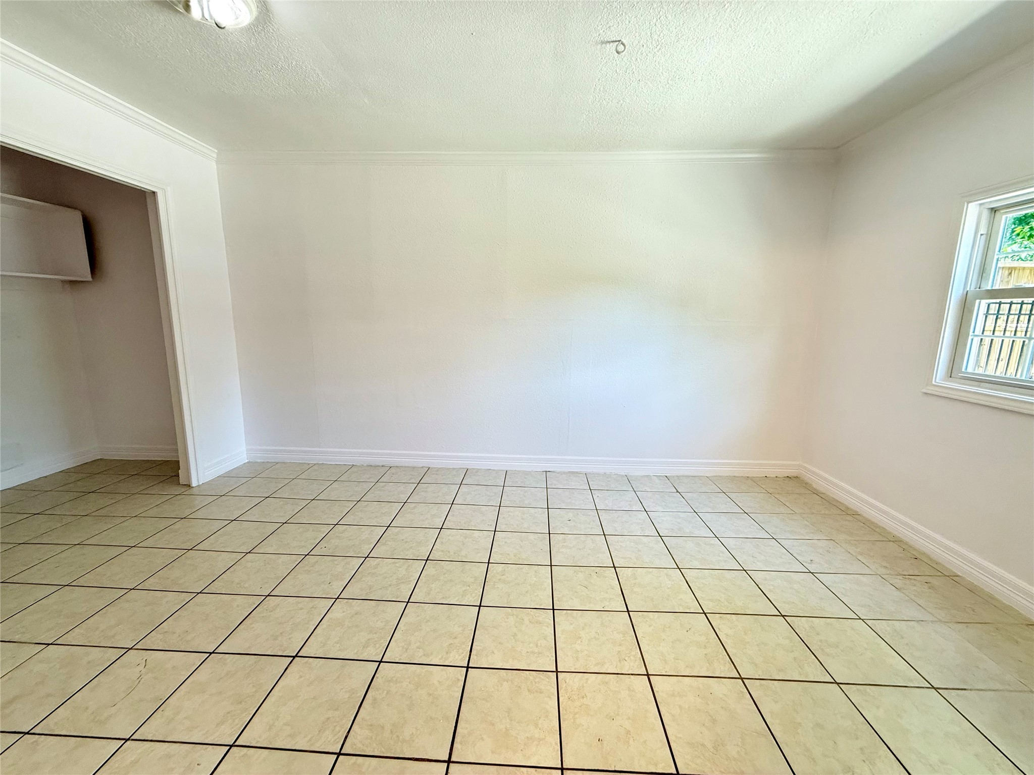 5701 Luna Street Houston, TX 77076 - Photo 27 of 50 a view of an empty room and window
