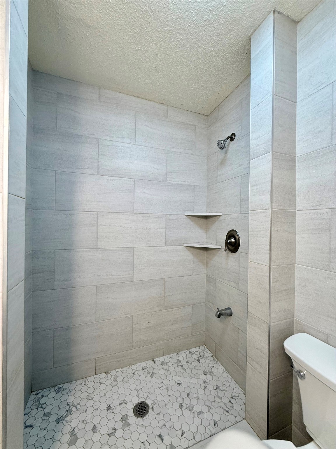 5701 Luna Street Houston, TX 77076 - Photo 40 of 50 a bathroom with a sink a toilet and shower