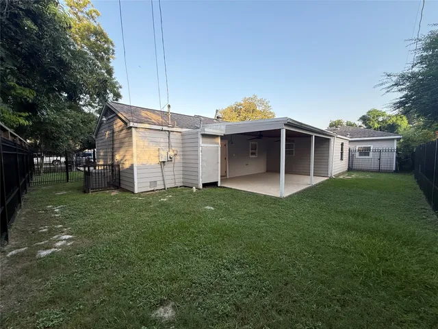 a view of a room with wooden floor and fence