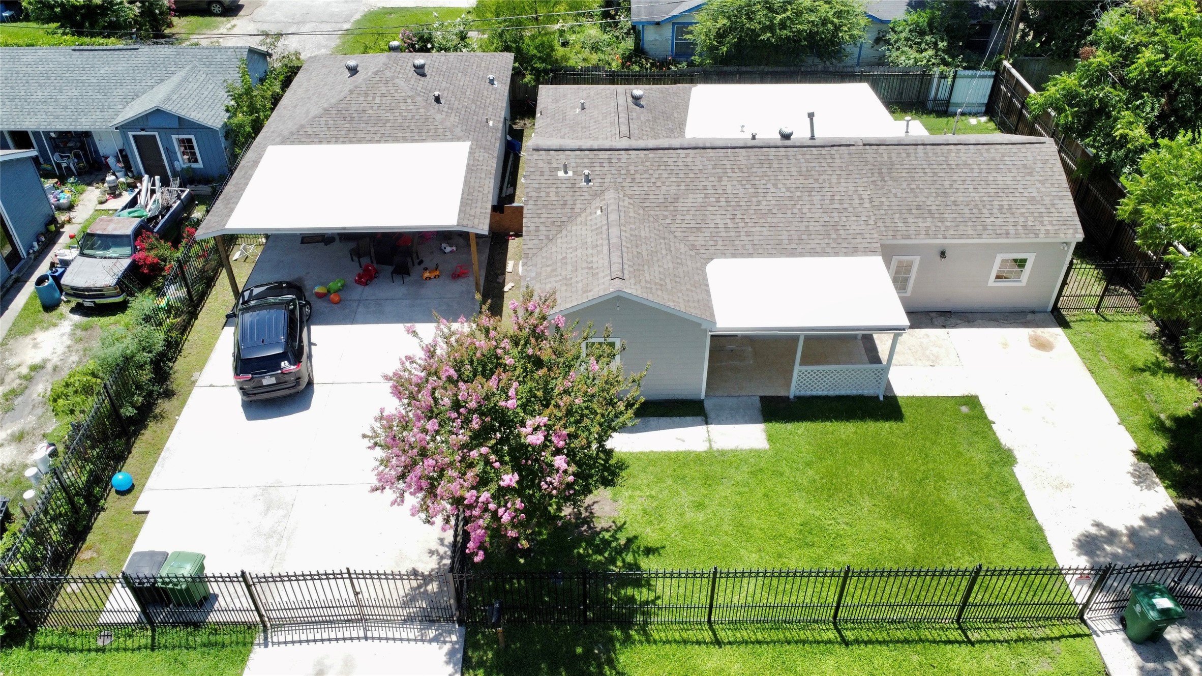 5701 Luna Street Houston, TX 77076 - Photo 9 of 50 an aerial view of a house with swimming pool and large trees