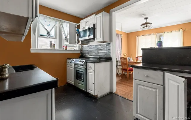 a kitchen with a stove and a microwave