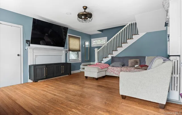 a bedroom with a bed and a television