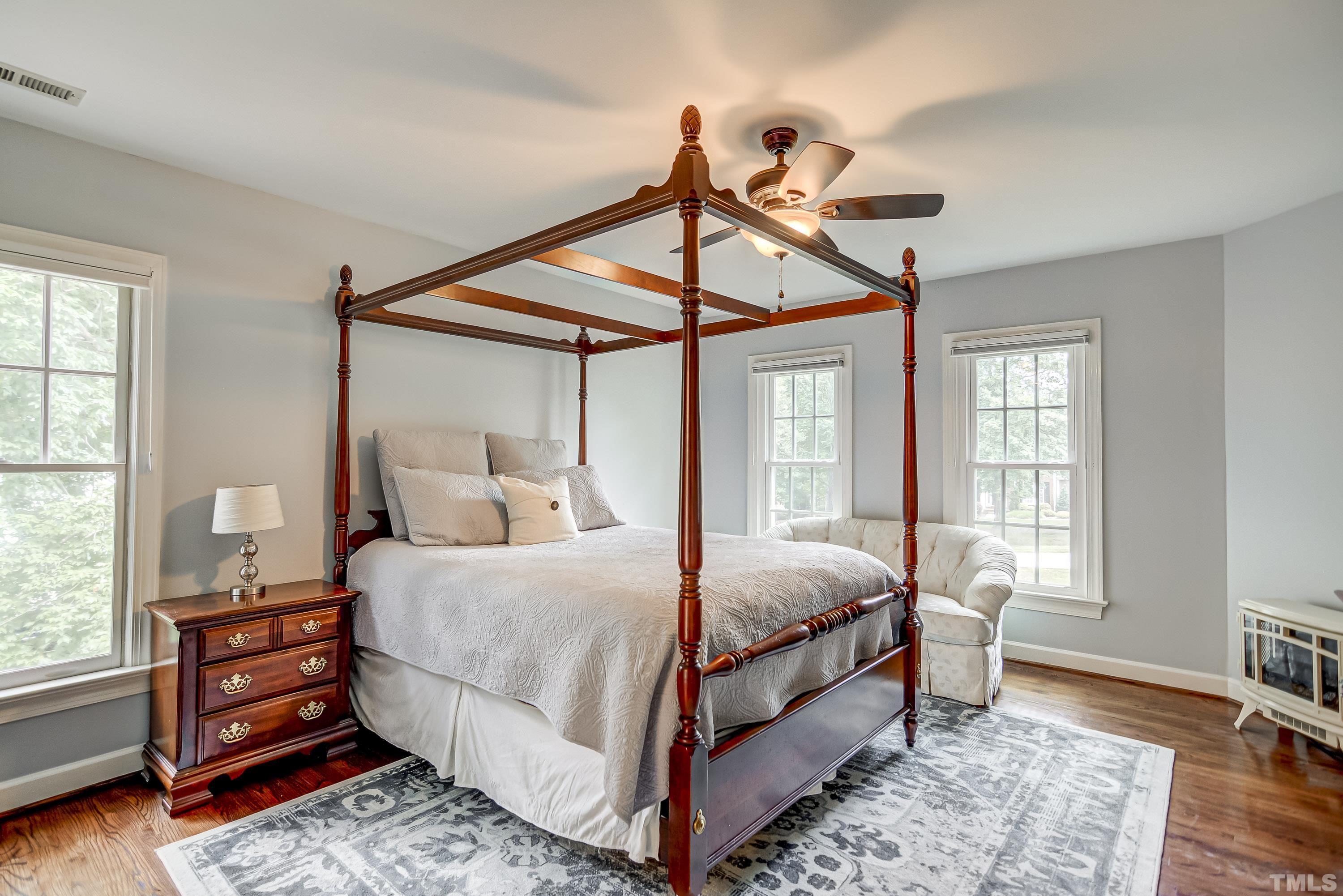 1309 Wescott Drive Raleigh, NC 27614 - Photo 17 of 32 a bedroom with a bed a window and dresser