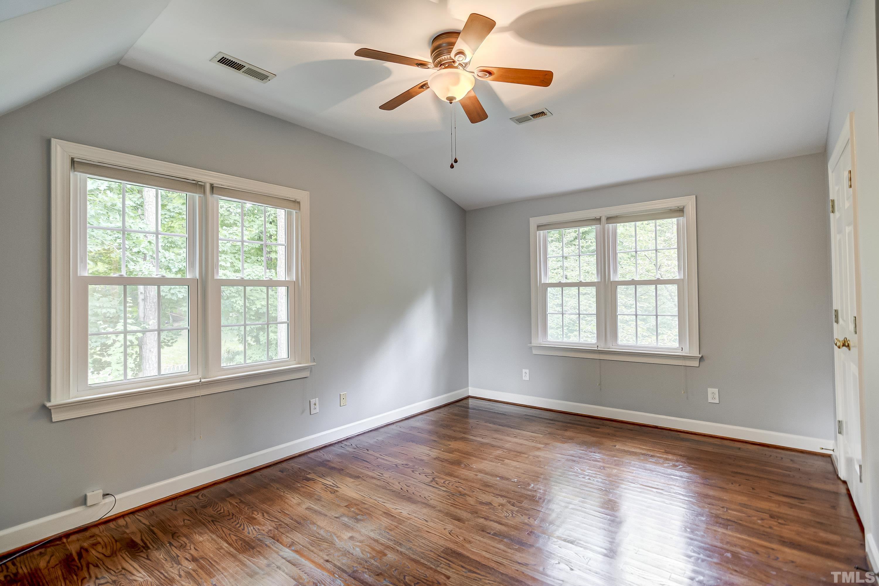 1309 Wescott Drive Raleigh, NC 27614 - Photo 22 of 32 a view of a room with wooden floor and windows