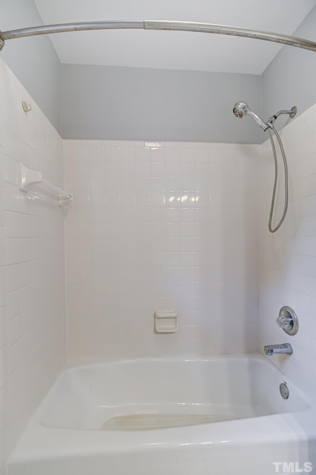 1309 Wescott Drive Raleigh, NC 27614 - Photo 24 of 32 a bathroom with a bath tub and a shower