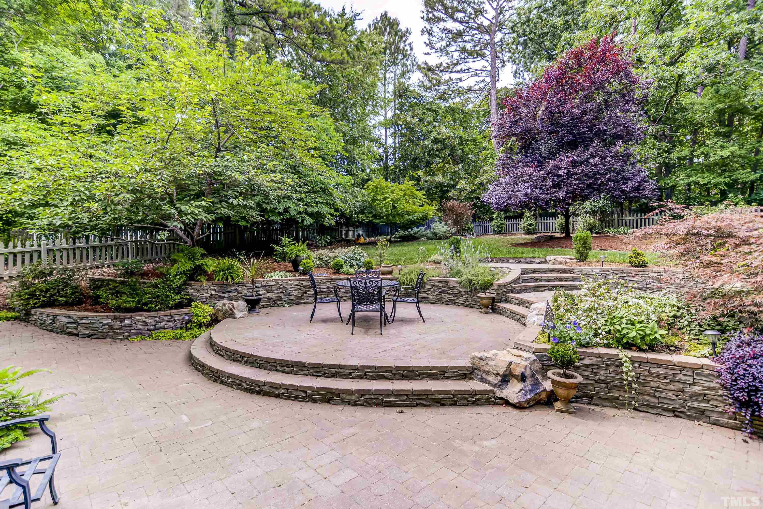 1309 Wescott Drive Raleigh, NC 27614 - Photo 26 of 32 a view of a backyard with plants and a patio