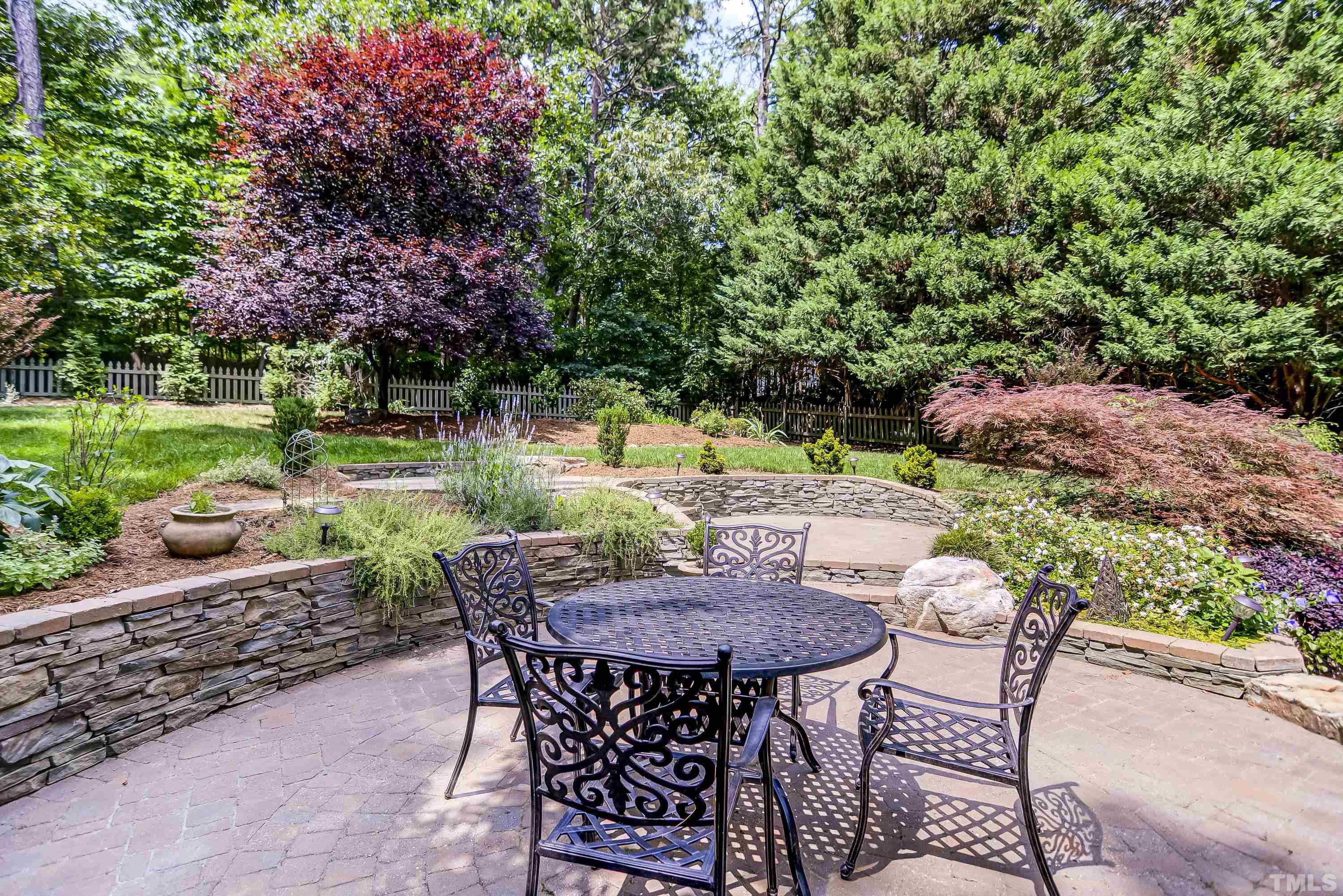 1309 Wescott Drive Raleigh, NC 27614 - Photo 29 of 32 a view of a chairs and table in the garden