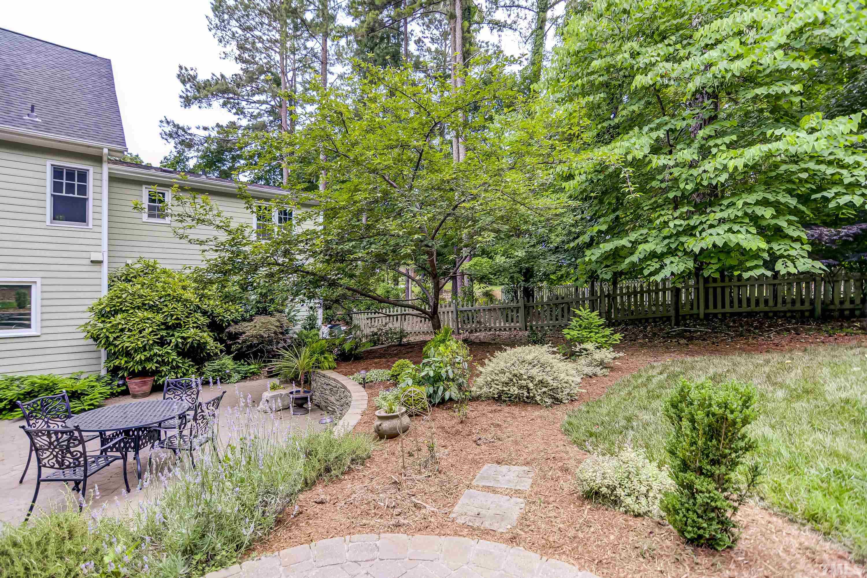 1309 Wescott Drive Raleigh, NC 27614 - Photo 30 of 32 a view of a chair and table in the garden