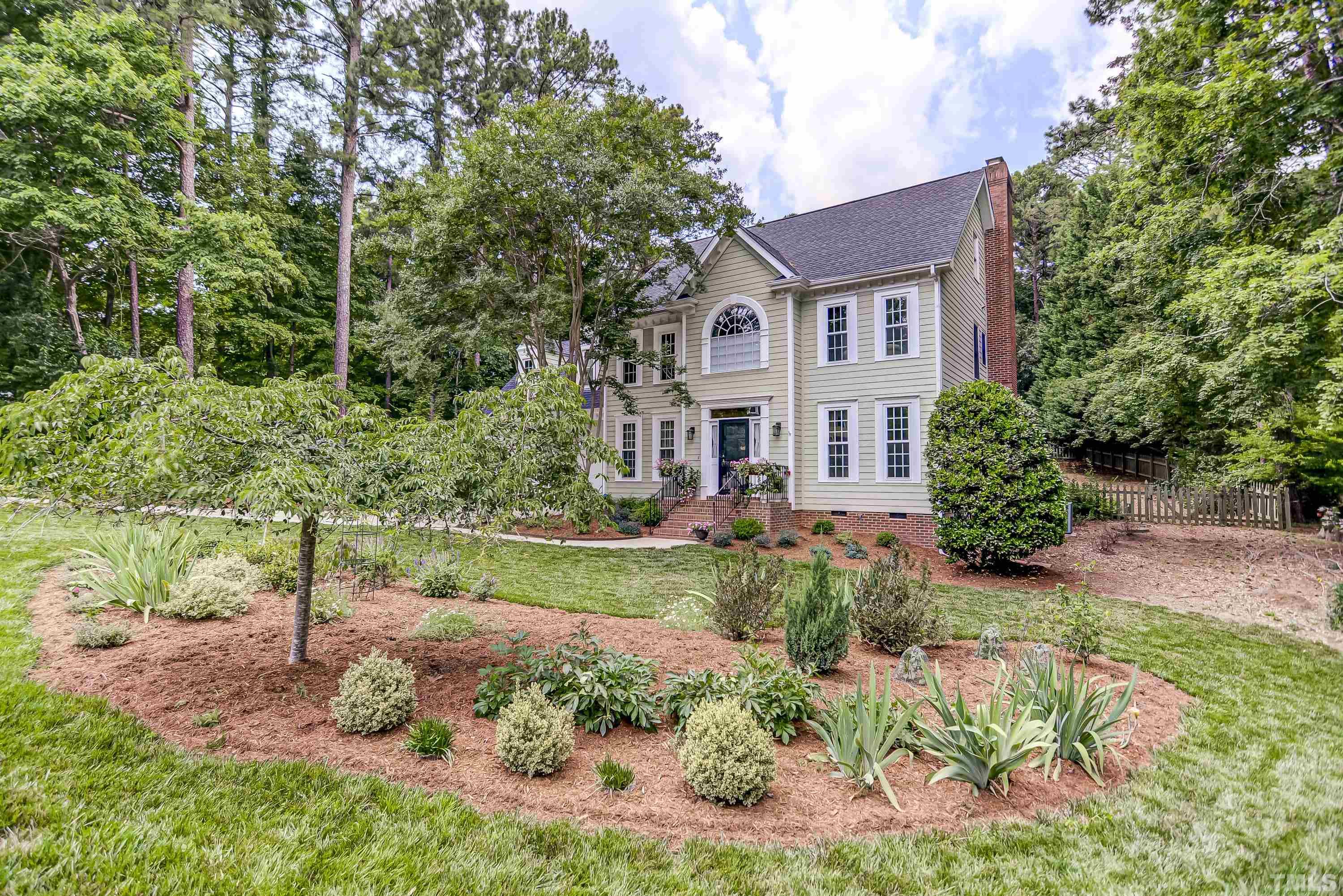 1309 Wescott Drive Raleigh, NC 27614 - Photo 4 of 32 a front view of a house with a yard and outdoor seating