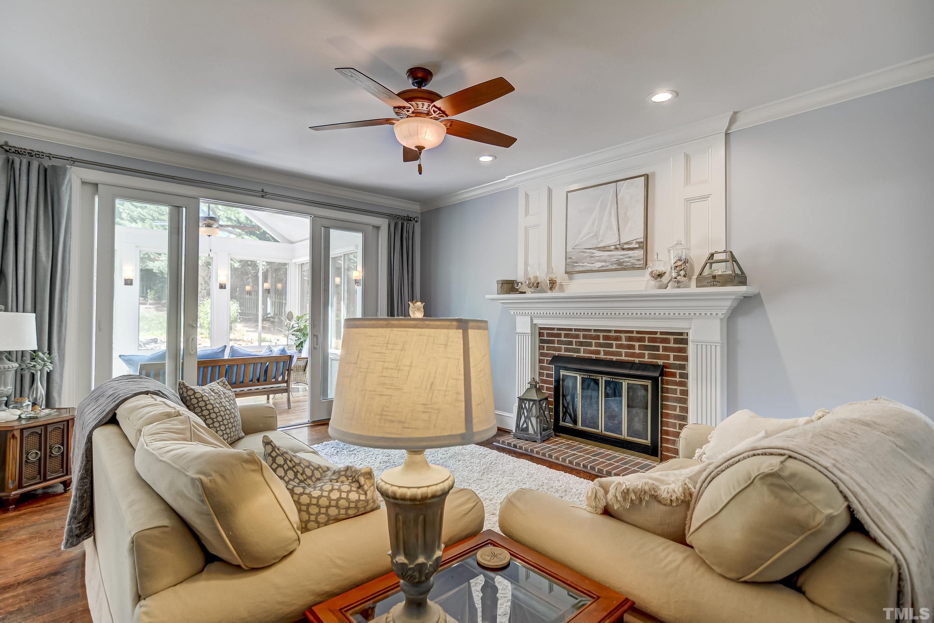 1309 Wescott Drive Raleigh, NC 27614 - Photo 6 of 32 a living room with furniture and a fireplace