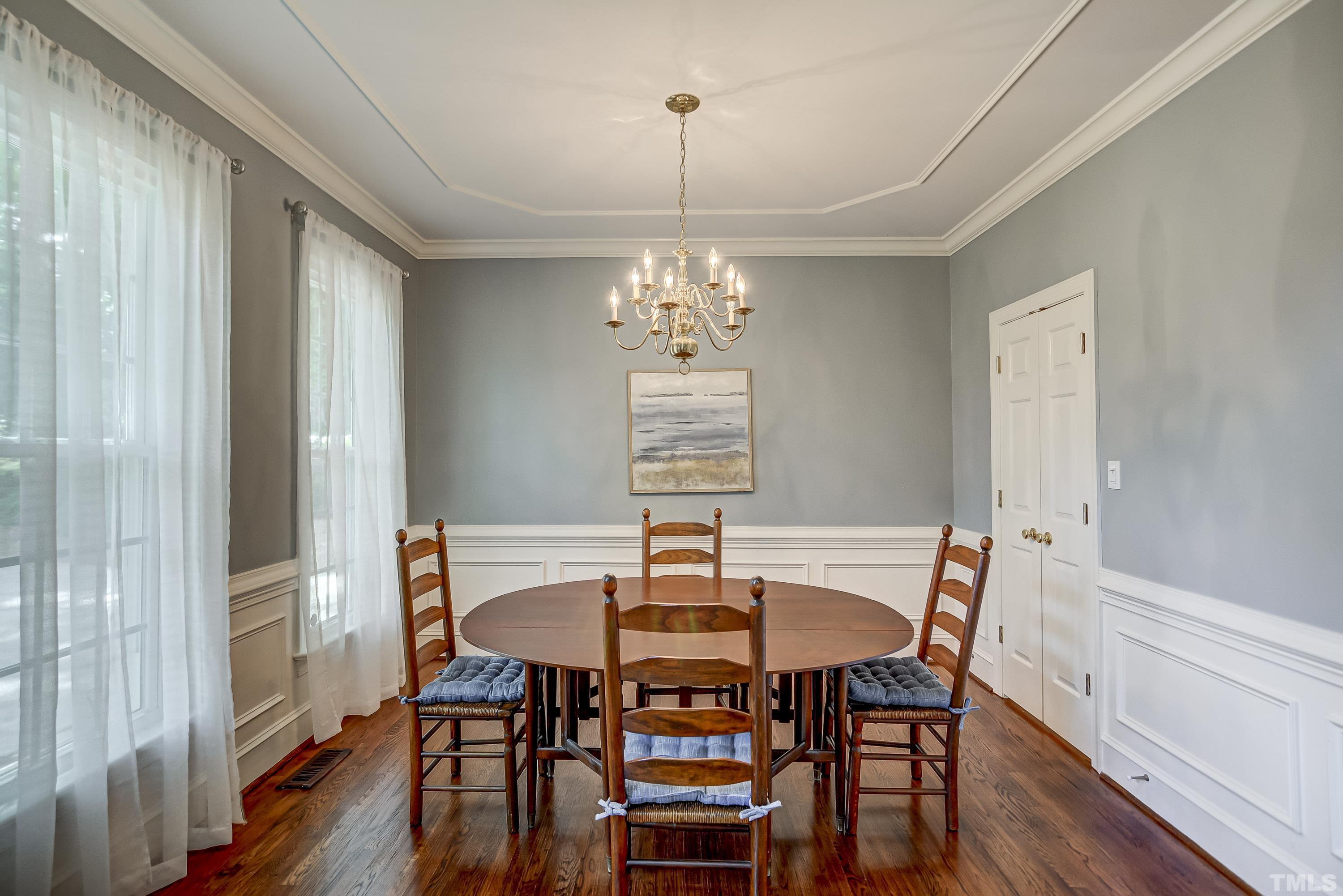 1309 Wescott Drive Raleigh, NC 27614 - Photo 7 of 32 a view of a dining room with furniture window and wooden floor