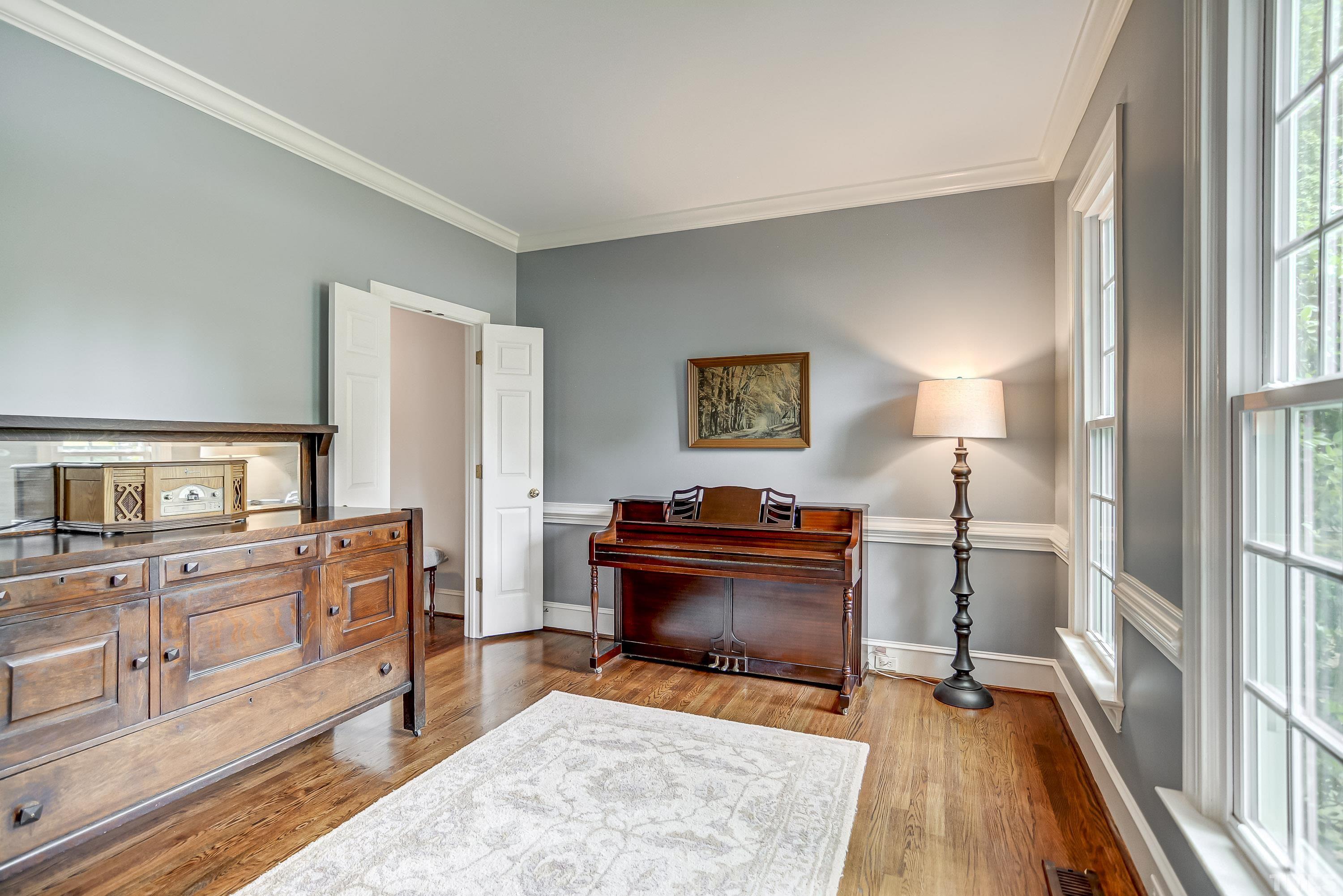 1309 Wescott Drive Raleigh, NC 27614 - Photo 9 of 32 a view of a kitchen with furniture a fireplace wooden floor and windows