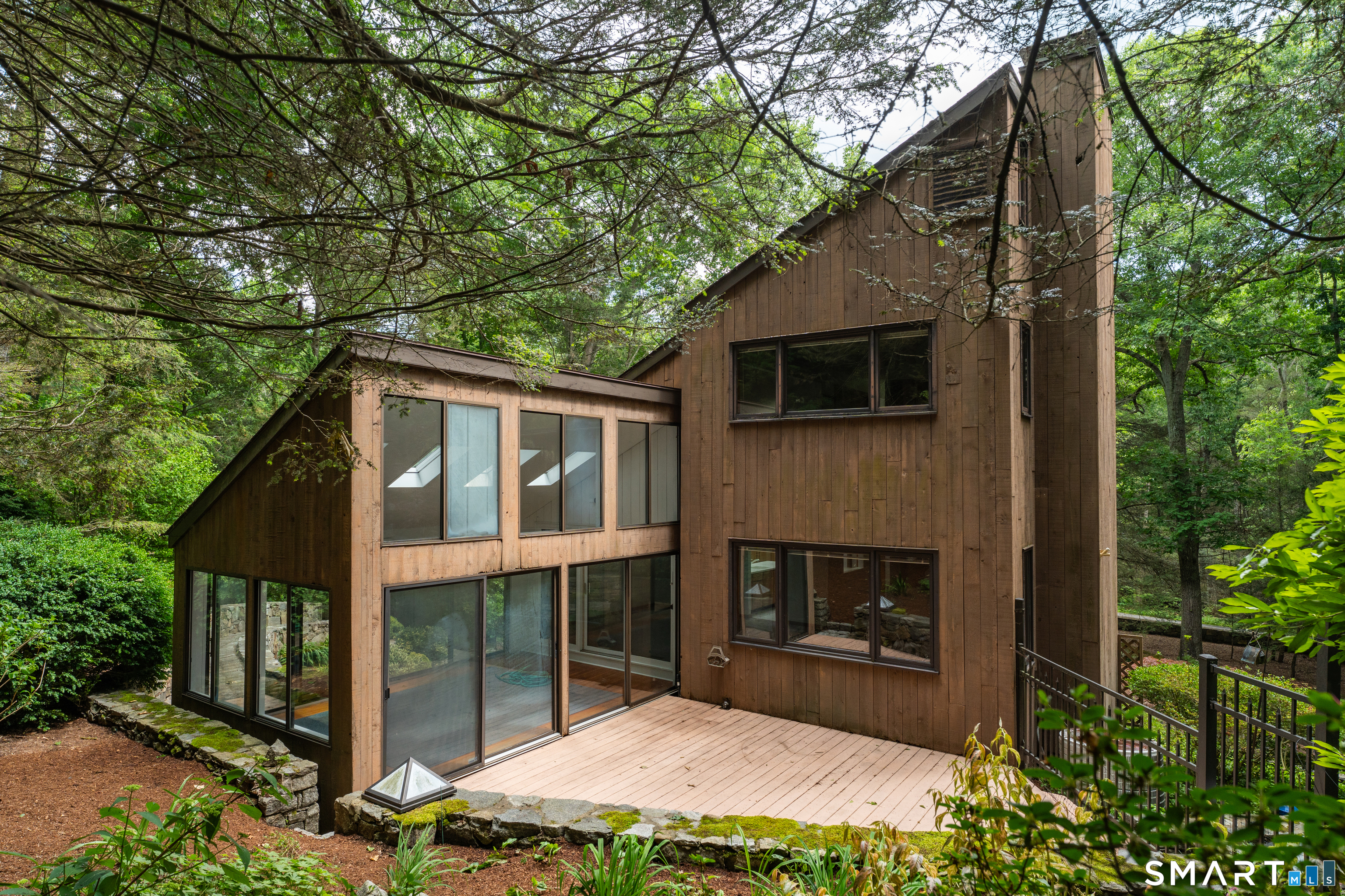 53 Summer Hill Road Madison, CT 06443 - Photo 5 of 29 Sunroom with sliders on both sides leading to decks on either side