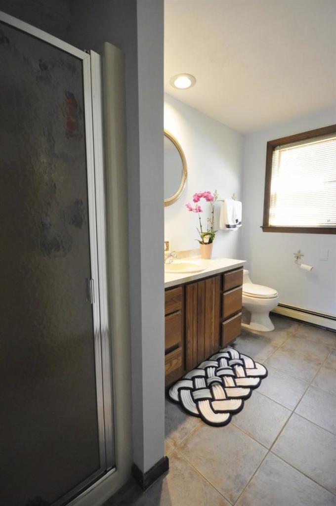 5 Easting Road Bourne, MA 02532 - Photo 13 of 26 a bathroom with a sink toilet and a mirror