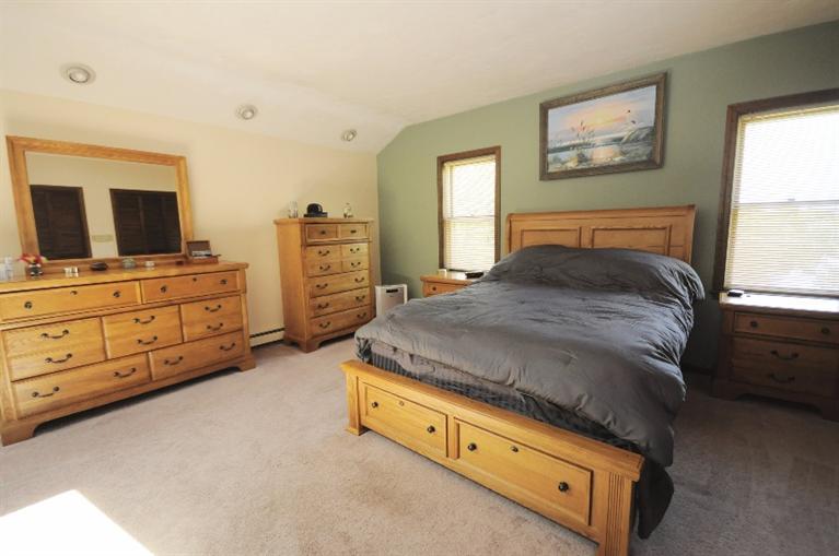 5 Easting Road Bourne, MA 02532 - Photo 18 of 26 a bedroom with a bed and furniture