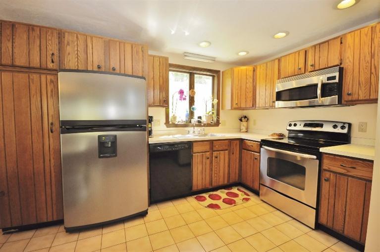 5 Easting Road Bourne, MA 02532 - Photo 6 of 26 a kitchen with stainless steel appliances granite countertop a refrigerator stove a sink and dishwasher